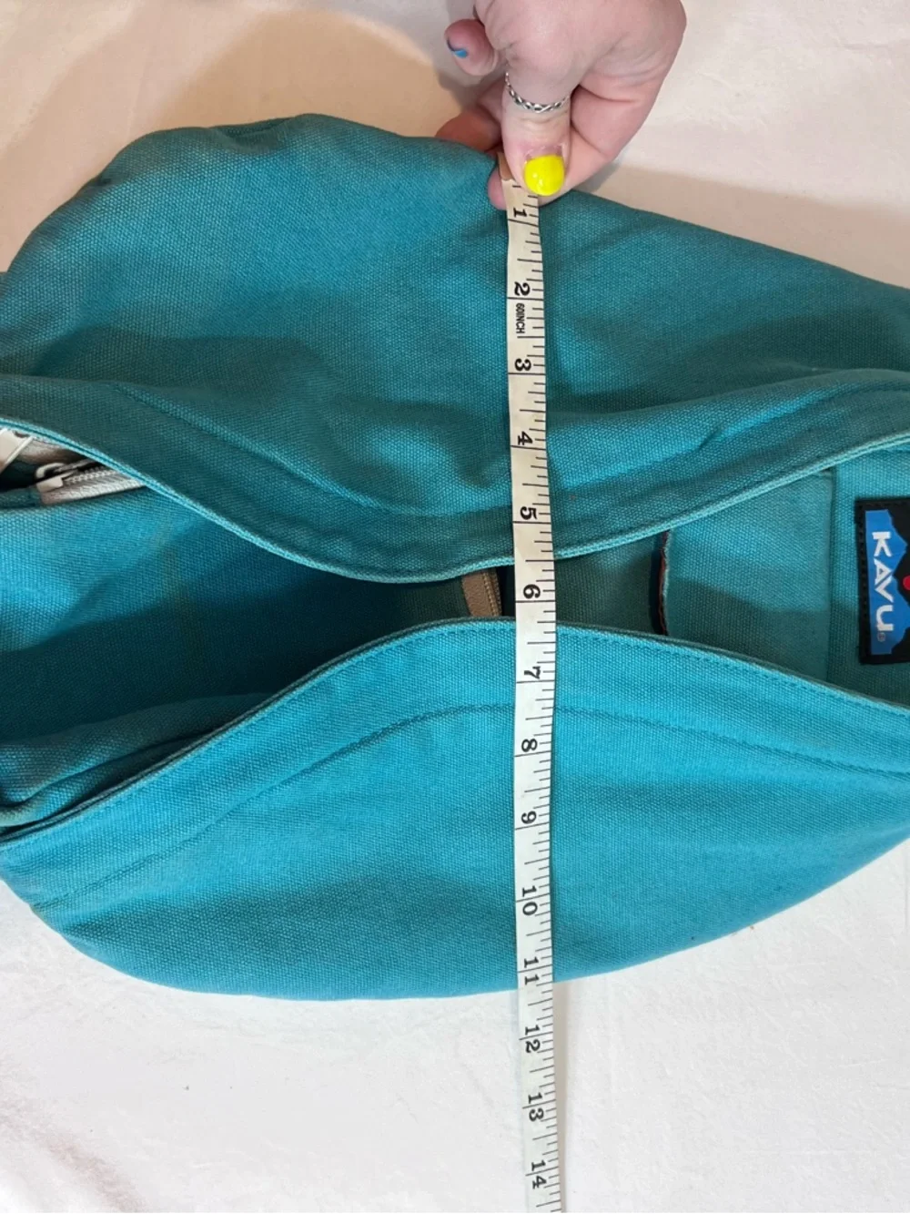 Kavu teal rope sling bag backpack